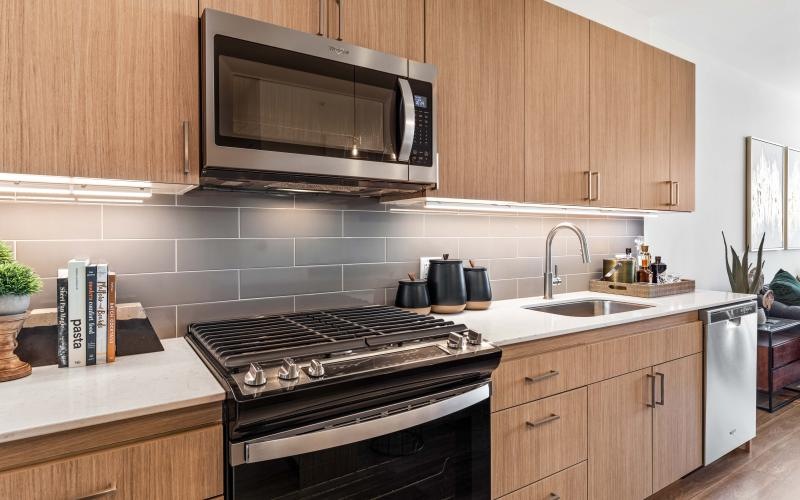 a kitchen with wooden cabinets