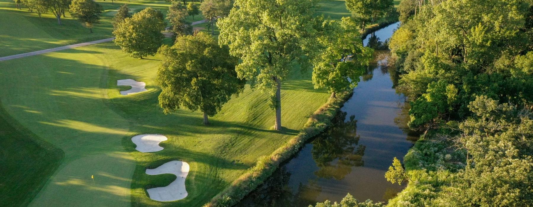 a golf course with trees
