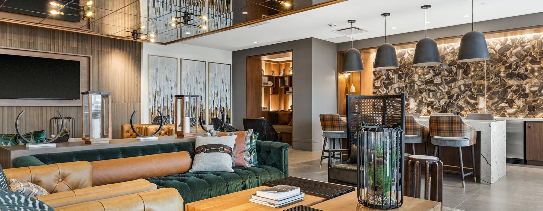 a room with a couch and chairs