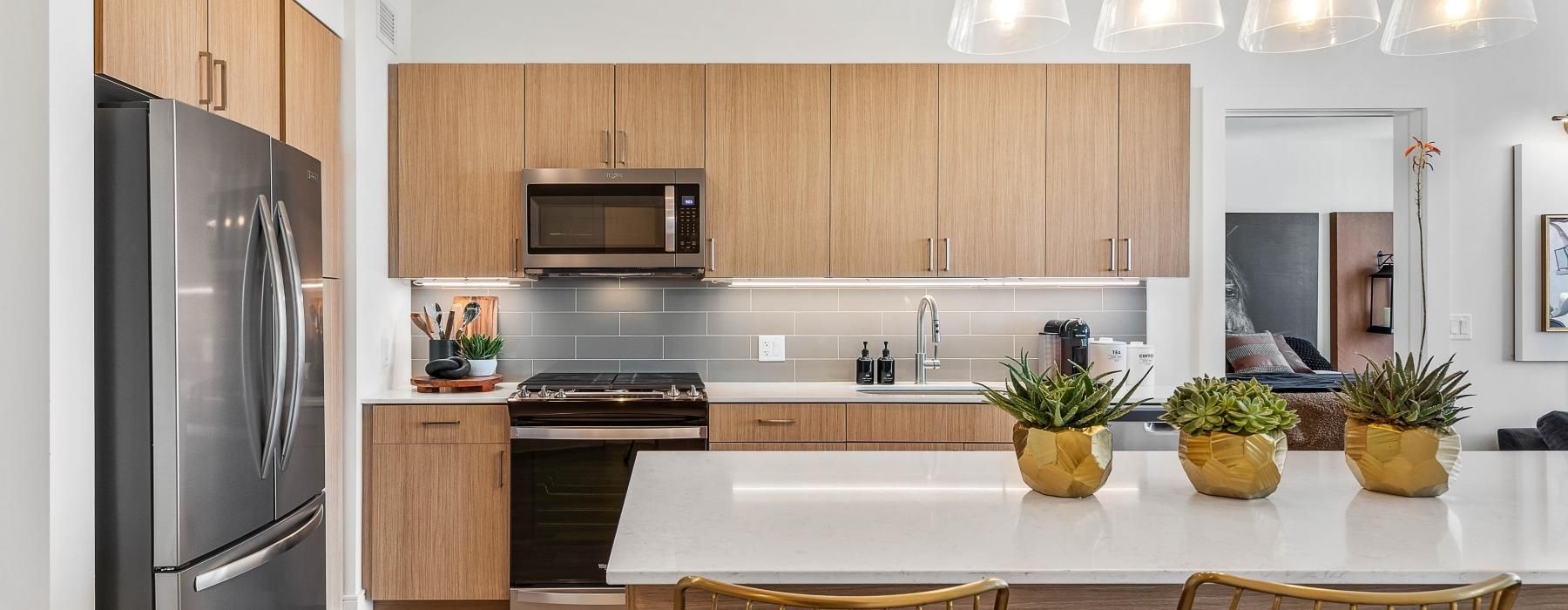 a kitchen with a bar and island